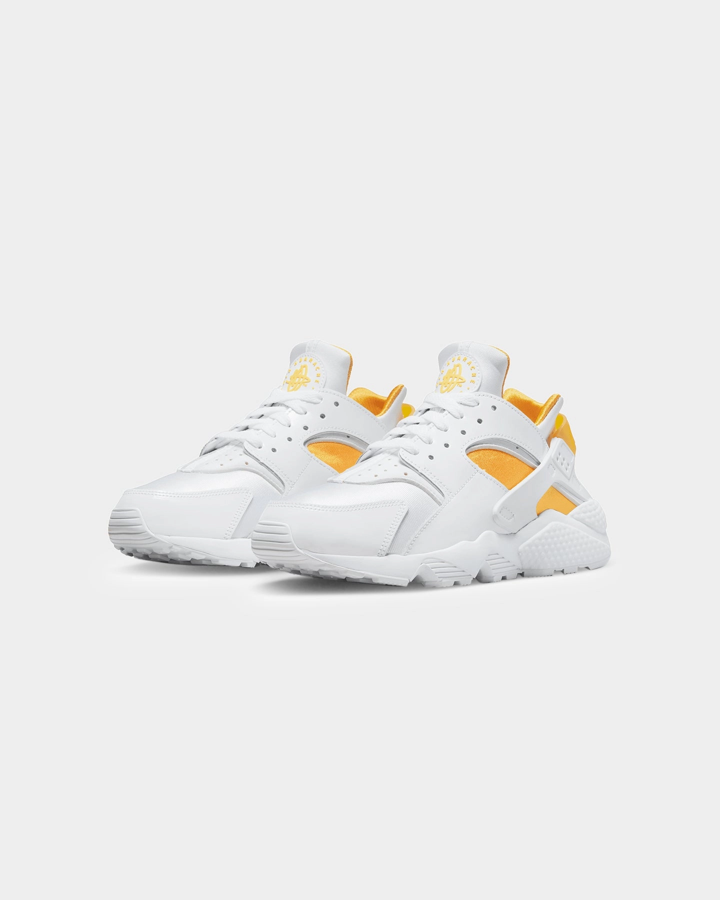 Nike Women's Air Huarache  White/University Gold Rolling Motion Technology