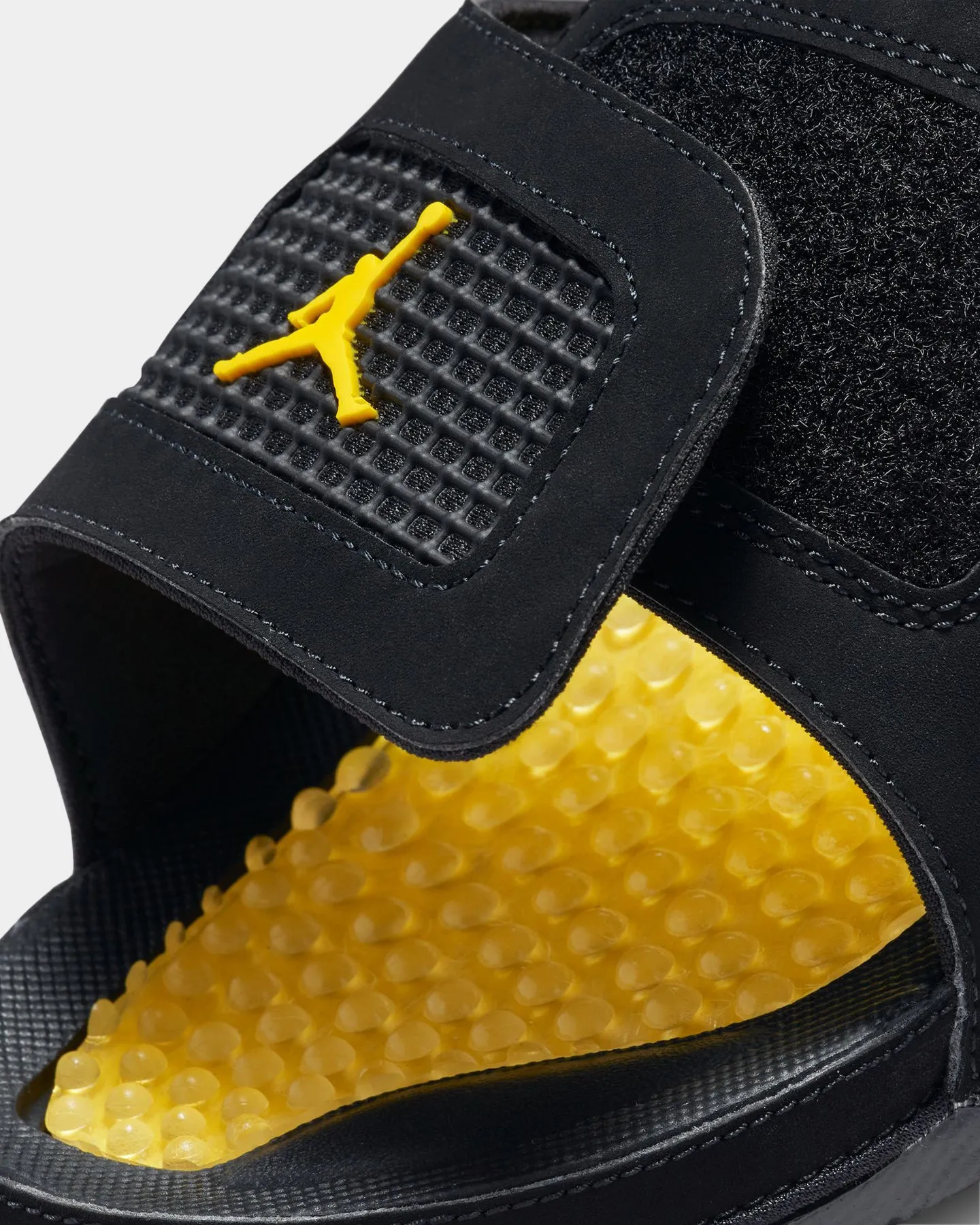 Jordan Hydro 4 Retro Black/Tour Yellow attention-grabbing cyclist